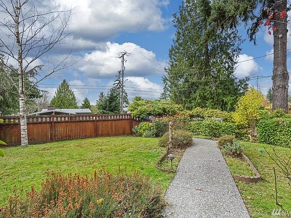 Aggregate pathway leads from the gate on 3rd Avenue to the entry on the side of the home. A beautiful yard to enjoy in peace and privacy. 