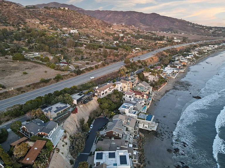A serene shoreline where waves meet the rugged coast.