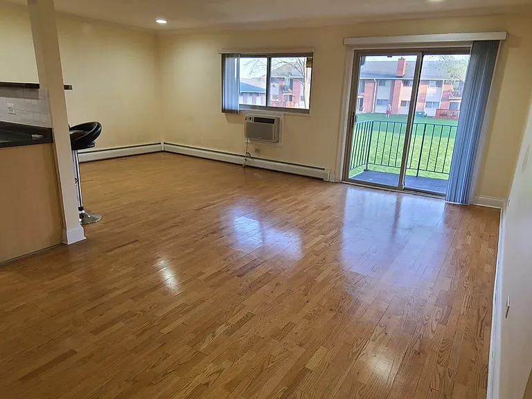 Living room with balcony overlookin court yard