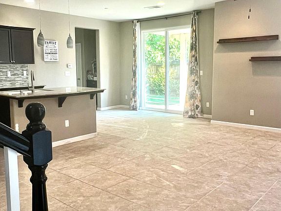 Kitchen has a slide door to the beautiful easy to handle backyard.