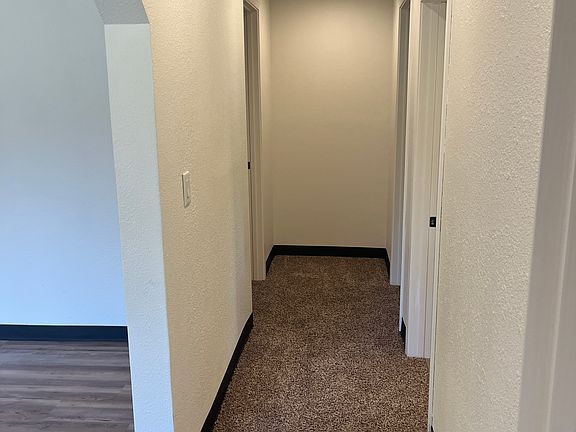 Room is at the end of this hallway on the left.