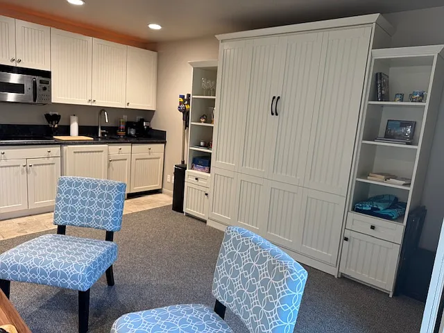 Wall bed with kitchen to left.