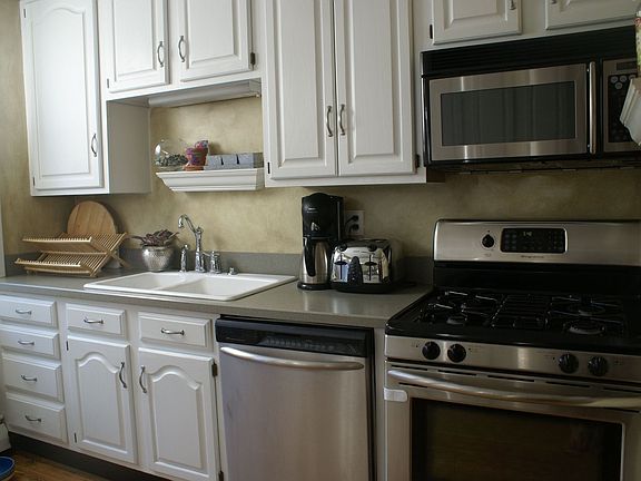 Stainless Steel Appliances and 42 in cabinets and Corian Countertops