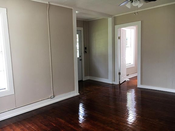 Living Room with extra room/bedroom off to the side, new flo