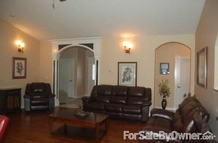 Large Open Living wood floors : 15 ft. ceiling, corner gas fireplace, entertaining easy and open