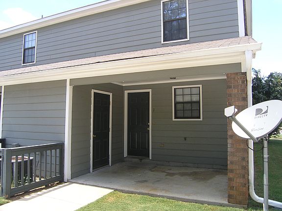 Rear View with Covered Patio and Storage Room