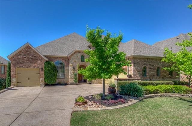 Gorgeous Brick and Stone home with 3 car garage