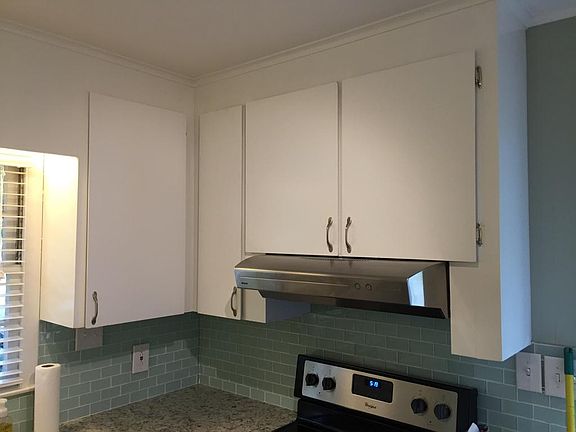 Kitchen with exhaust hood over stove