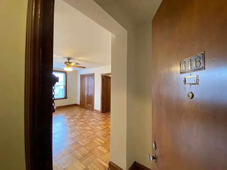 Entering from the hallway, into the main room, you will find the space is filled with the natural light and historical charm.