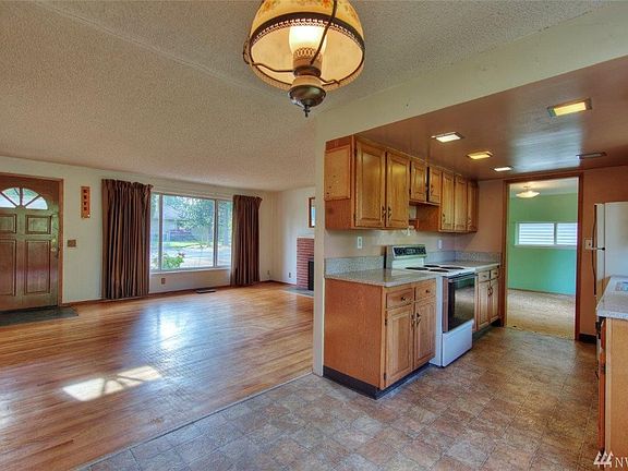 Kitchen leads to dining room with large pantry