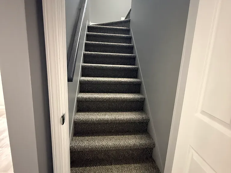 stairway to upstairs main suite