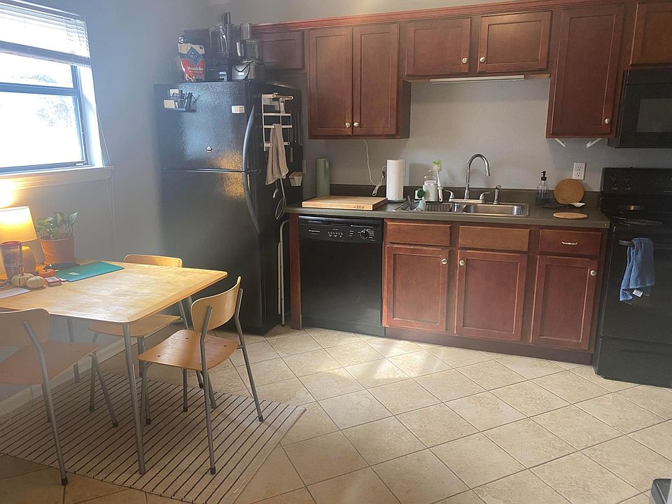 Kitchen with dishwasher, range, and refrigerator