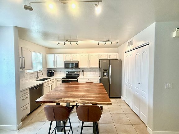 Kitchen, laundry with new washer dryer in sliding doors