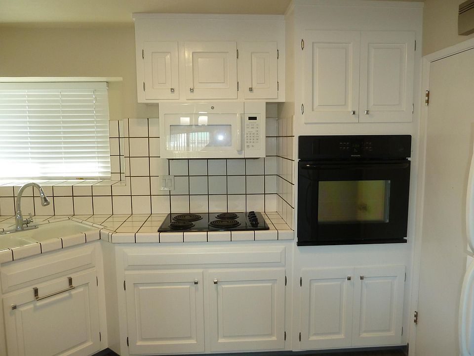 Upgraded kitchen with Shaker style cabinetry, newer appliances & Vinyl Plank Flooring.
