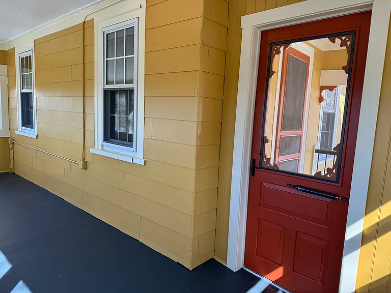 The porch door has the option to change the glass window to a screened option for warmer months.