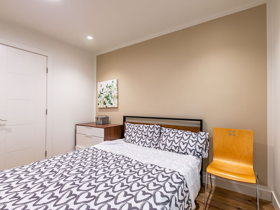 Clothes closet , table and chair, and small fridge