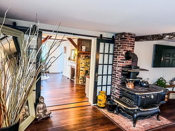 Living Room Charm: Original restored cook-stove keeps us warm on crisp New England days.