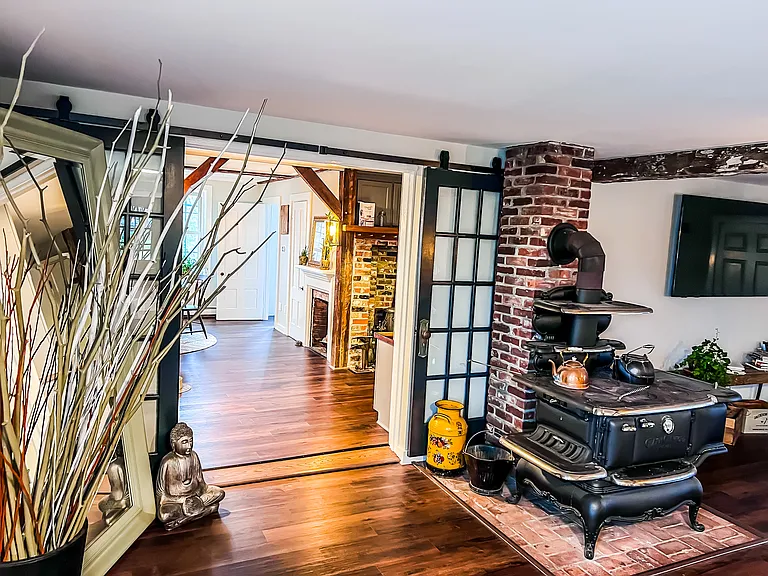 Living Room Charm: Original restored cook-stove keeps us warm on crisp New England days.
