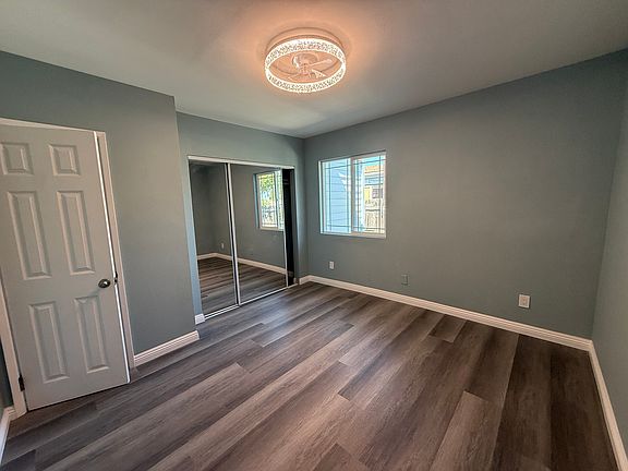 Bedroom has brand new window and a sliding mirror closet door. New lighting fixture with fan as well.