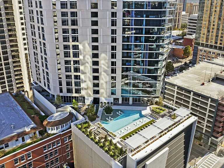 Elevated living with a rooftop pool and stunning cityscape views_luxury above it all.