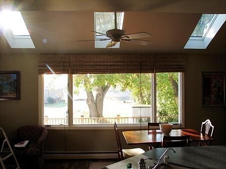 Panoramic window provides sweeping views of lake.