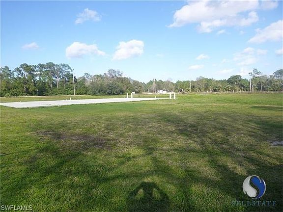 View of land standing by shed behind home