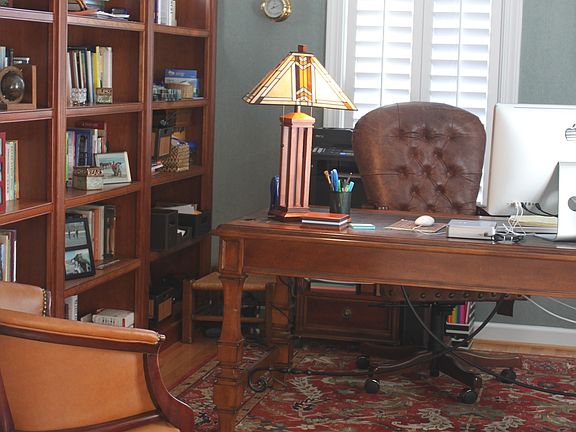 Den with cherry bookshelves