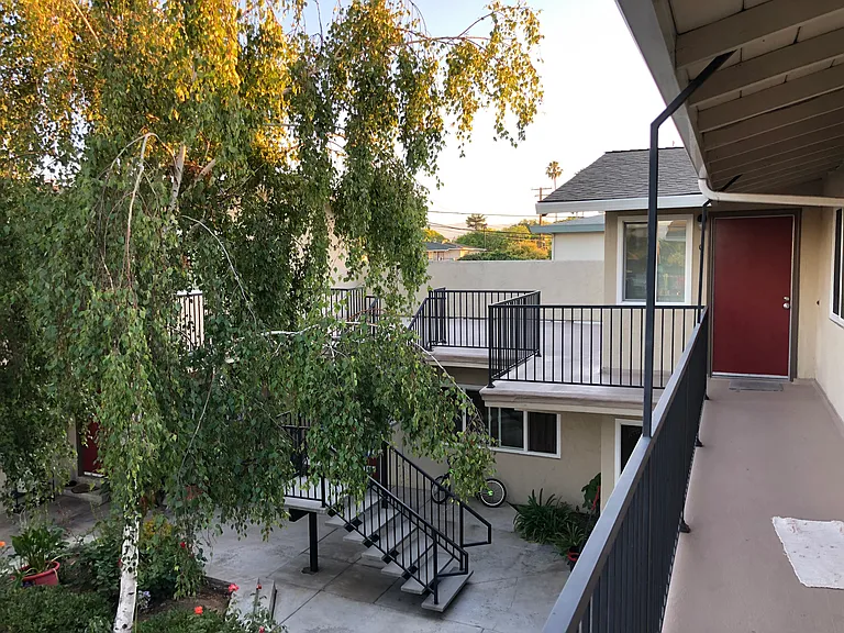 The interior patio has a rose garden and shade trees. New acrylic walkway.
