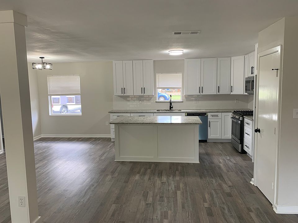 Kitchen with brand new dishwasher and oven complete with gas stove