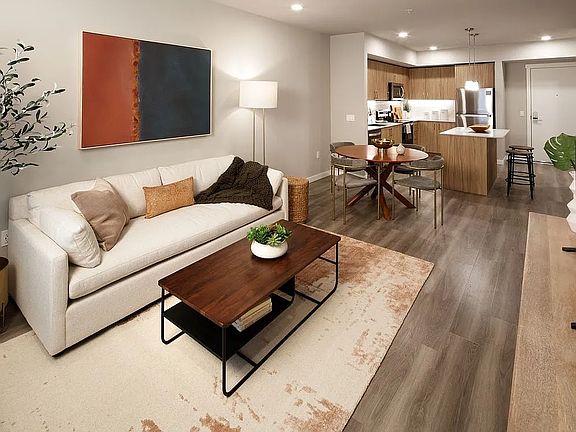 Design Collection II Kitchen with oak cabinetry and living and dining areas with hard surface flooring