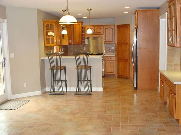 This kitchen has custom maple cabinets,computer area,and large pantry.