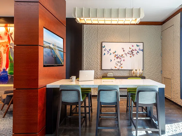 Great meeting space with conference table and large TV