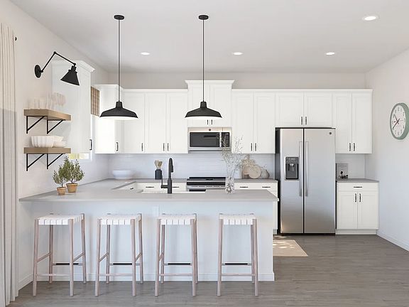 Kitchen with white cabinets floating shelves