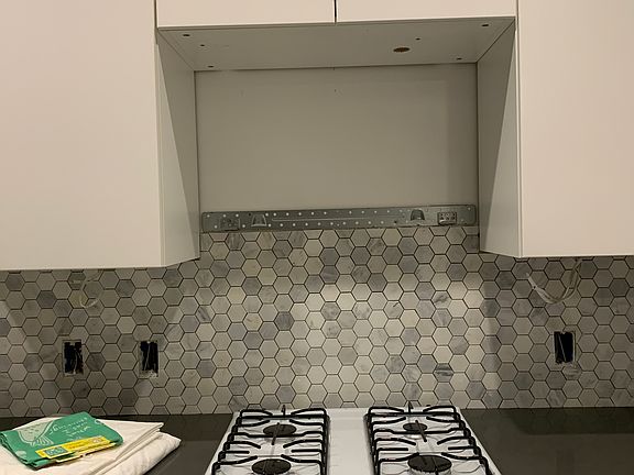 Four burner propane stove and oven. Microwave too.