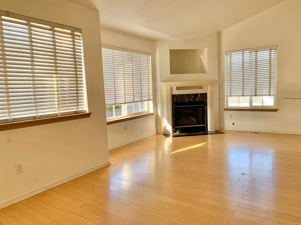 Open and bright living and dining room with a beautiful fireplace - 11850 44th Pl S
