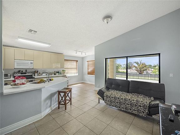 4th image of 9999 Summerbreeze Drive #303
