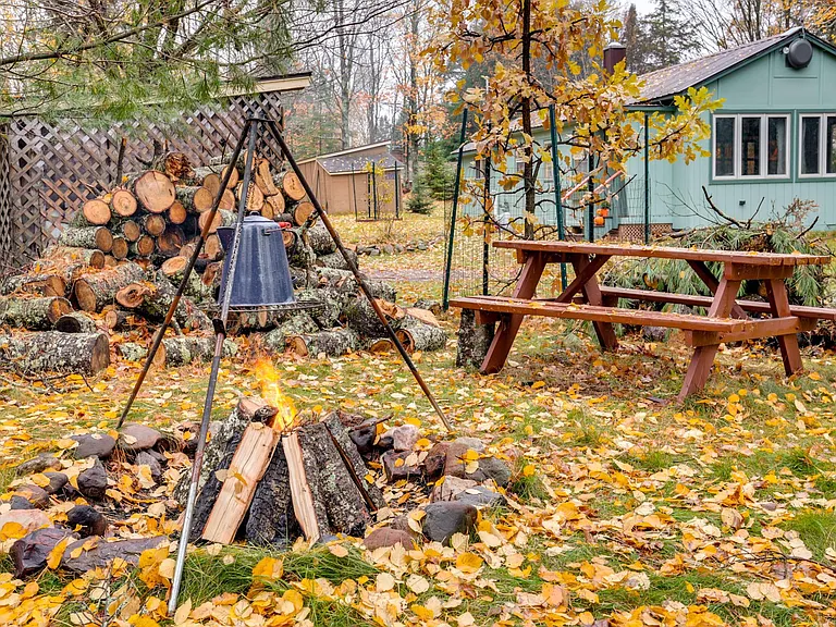 Fire Pit, cook on the fire, enjoy a few friends and family, wood included at Ian's Place Watersmeet Mi Vacation Rental