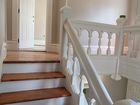 Half way up the staircase.