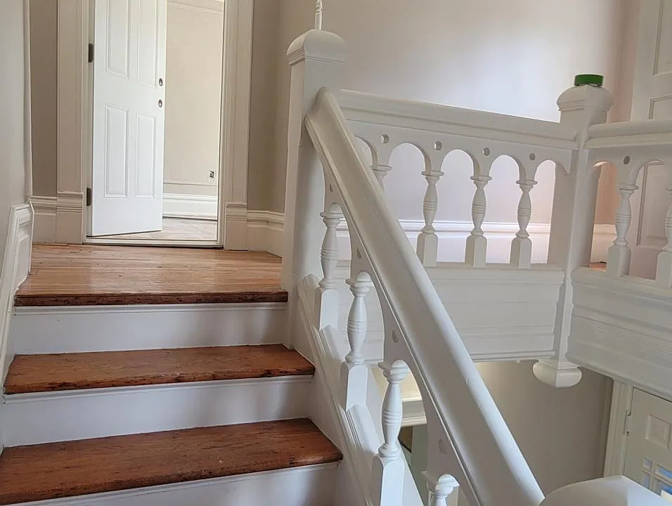 Half way up the staircase.