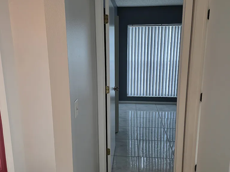 leaving bedroom 1 to go into bedroom 2 which is in front of the house