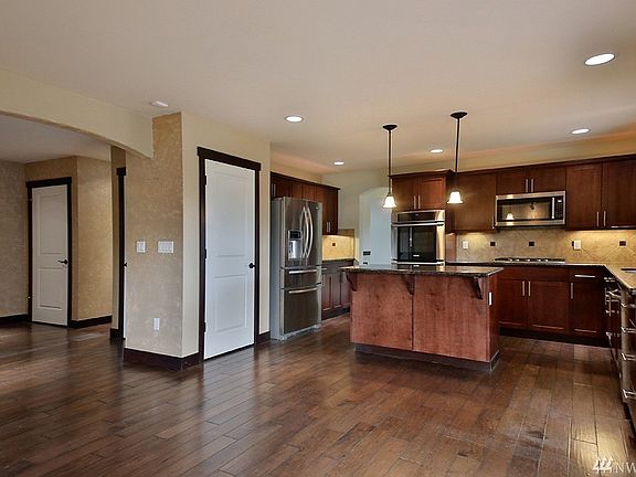 The tile backsplash makes for easy clean up and there is ample counter space here for making your favorites!