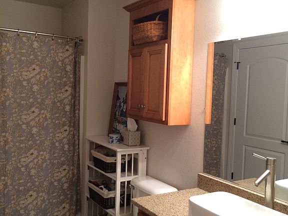 Bathroom features tub and shower