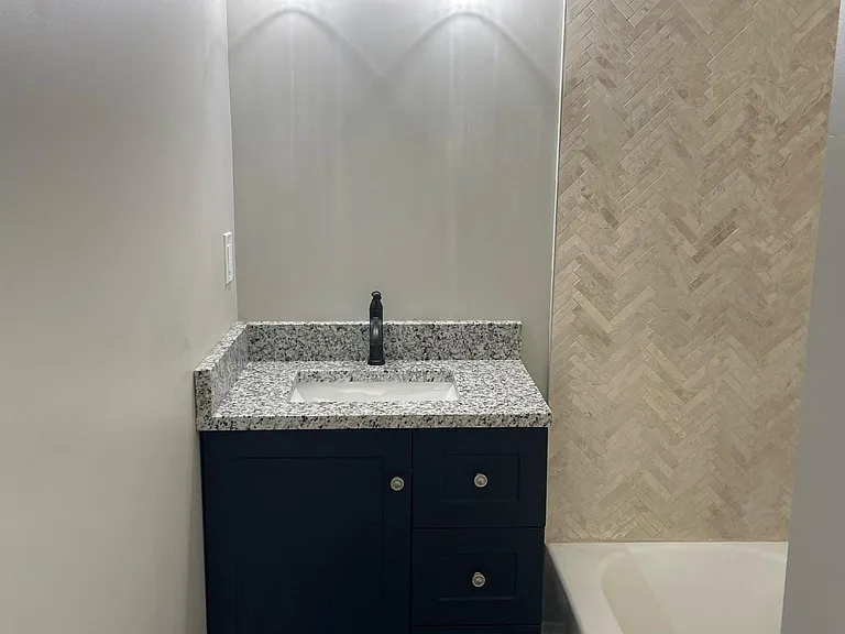 Bathroom with tub and shower