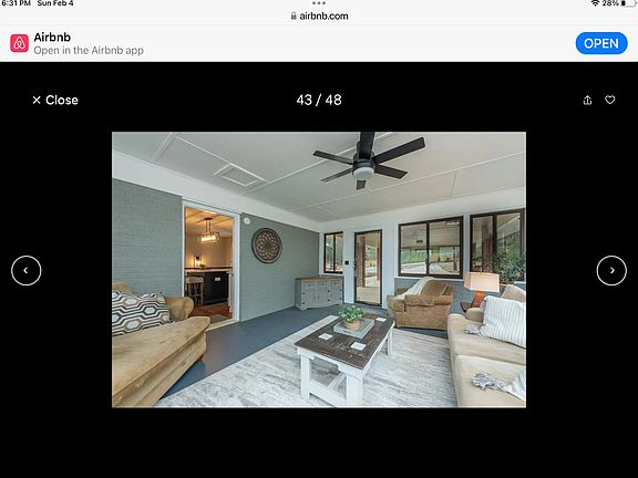 This is the sunroom with a view into the kitchen off the sunroom