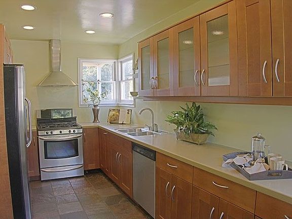 Kitchen with Corian counters and custom cabinets