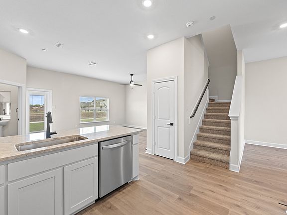 The open concept layout of the Appaloosa connects the kitchen with the dining area and family room.