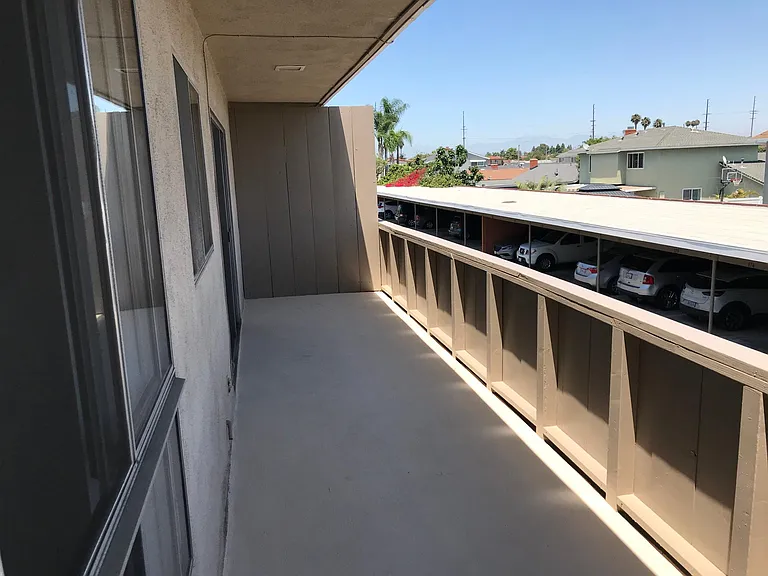 Large balcony standing at the upstairs bedroom window of a 1x1