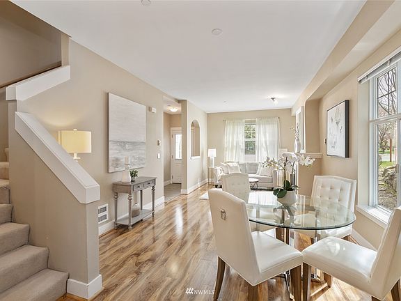 Gleaming floors flow throughout the main living areas and the kitchen. 