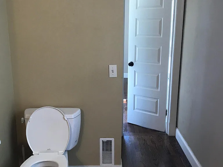 Upstairs bathroom showing door to bedroom 2