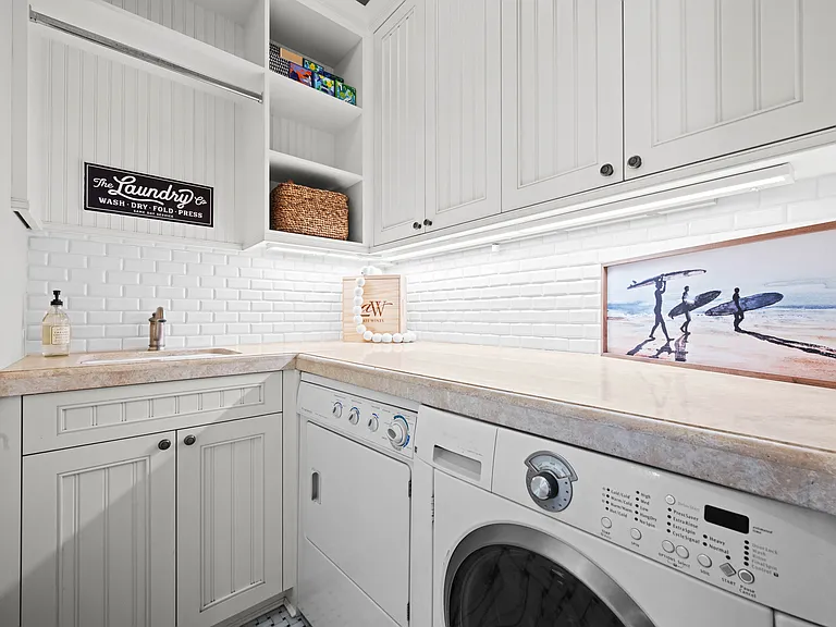 Laundry Room off garage entry with sink and lots of storage